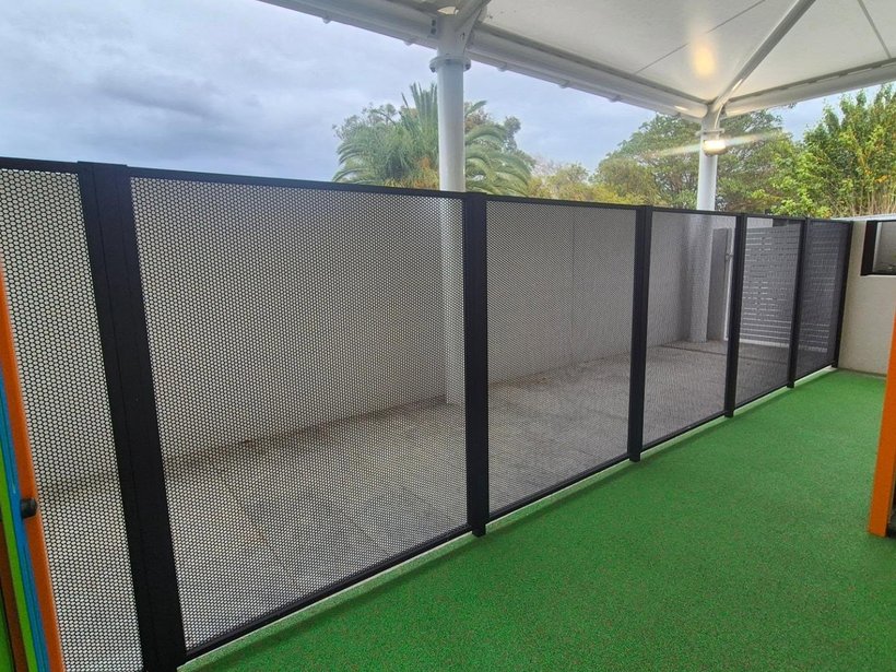 Perf Safe perforated fence around a childcare centre synthetic-turf play area
