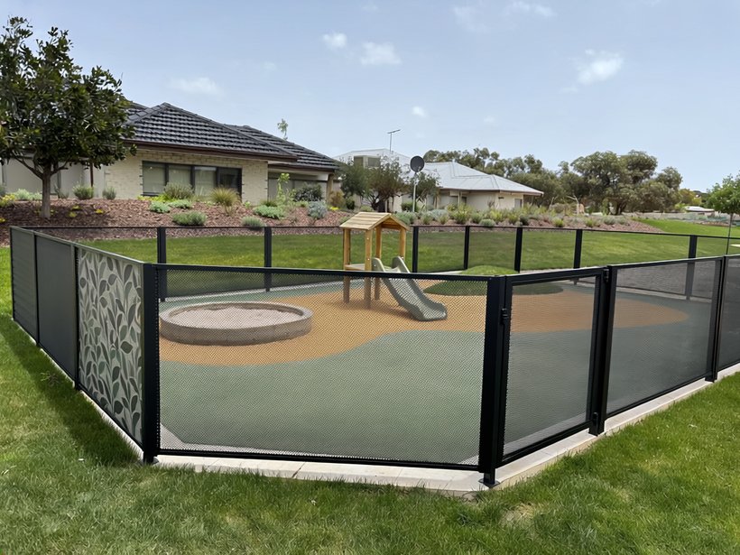 Perf Safe childcare fence with a playground and centre building behind